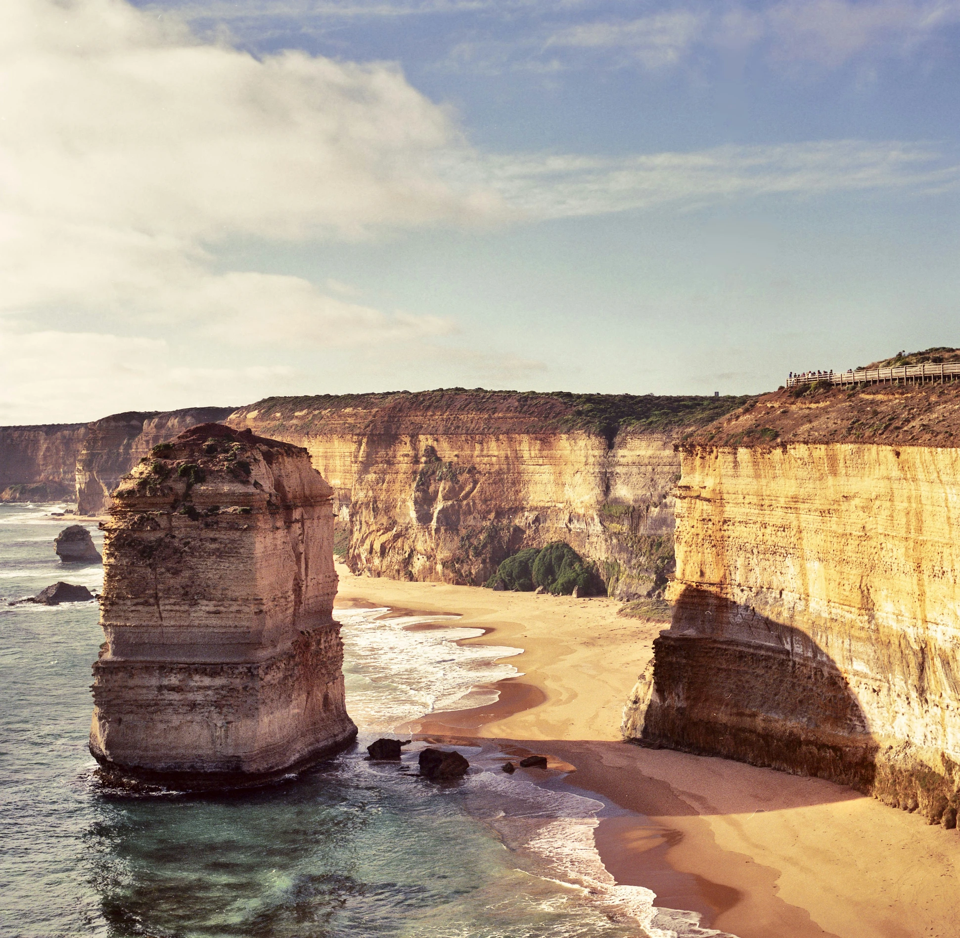 a rocky beach and two cliffs with an ocean below