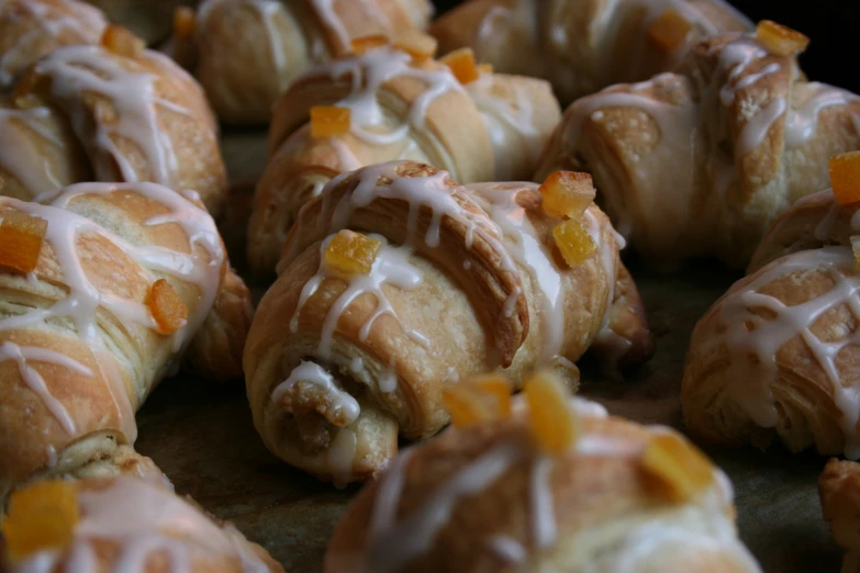 an assortment of glazed pastries with icing