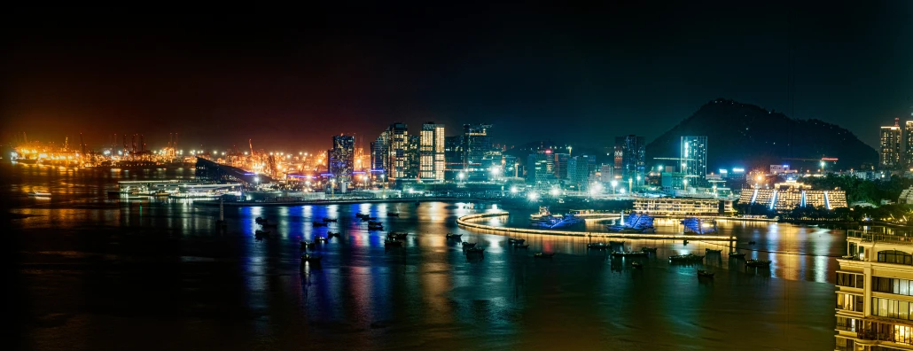 night time view of city lights over water