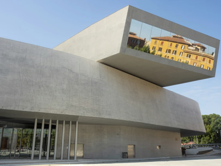 an interesting building that is reflected in the windows