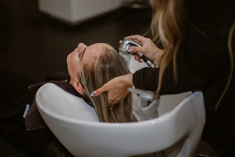 woman at a salon getting her hair washed