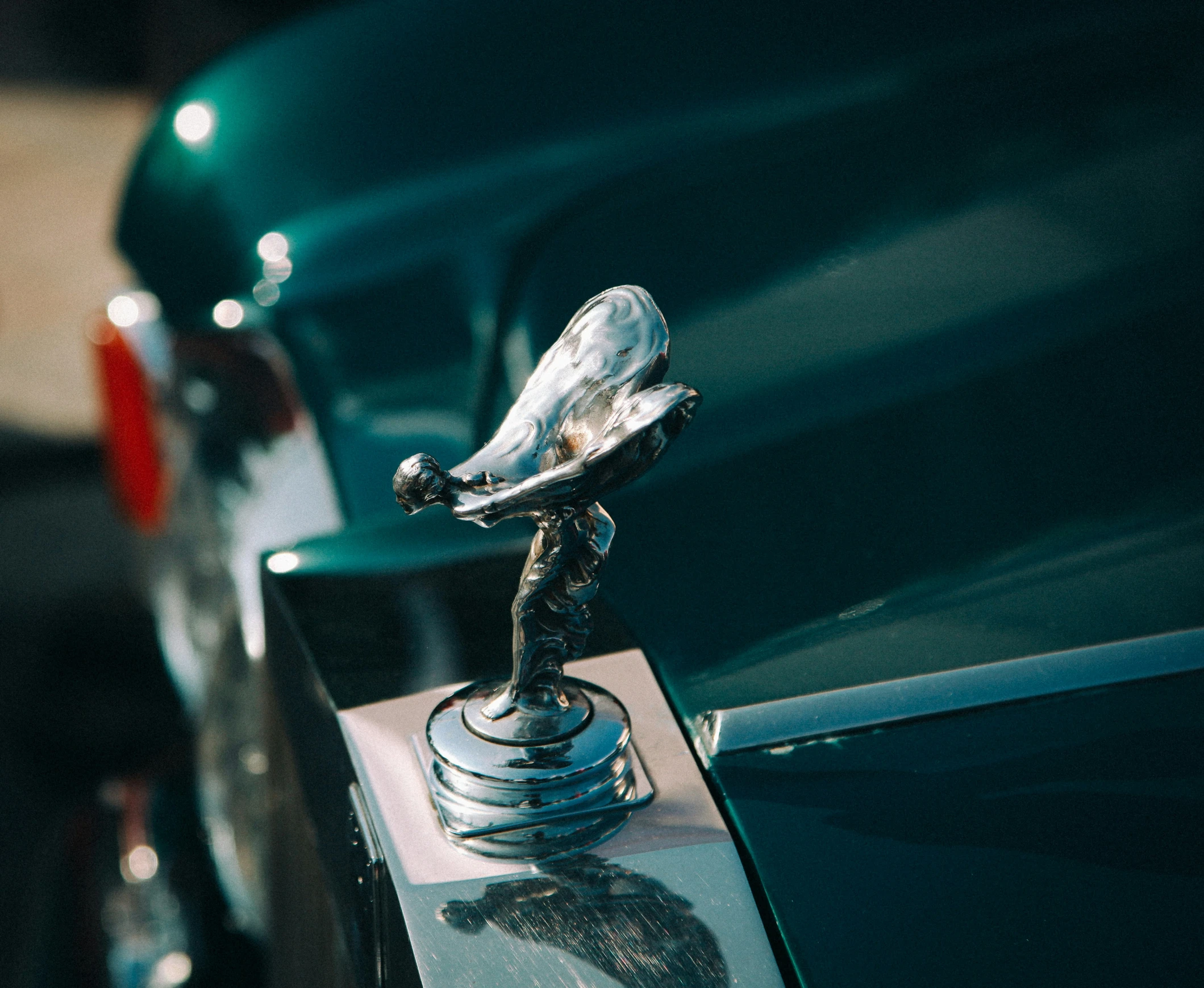 the hood ornament of an old car