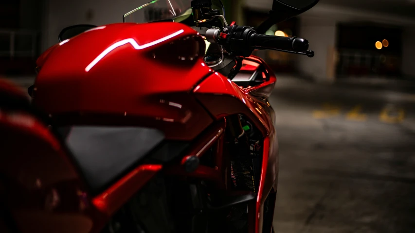 close up of the rear wheel of a red motorcycle