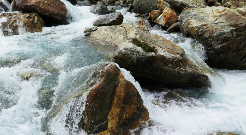 a water stream running between some rocks