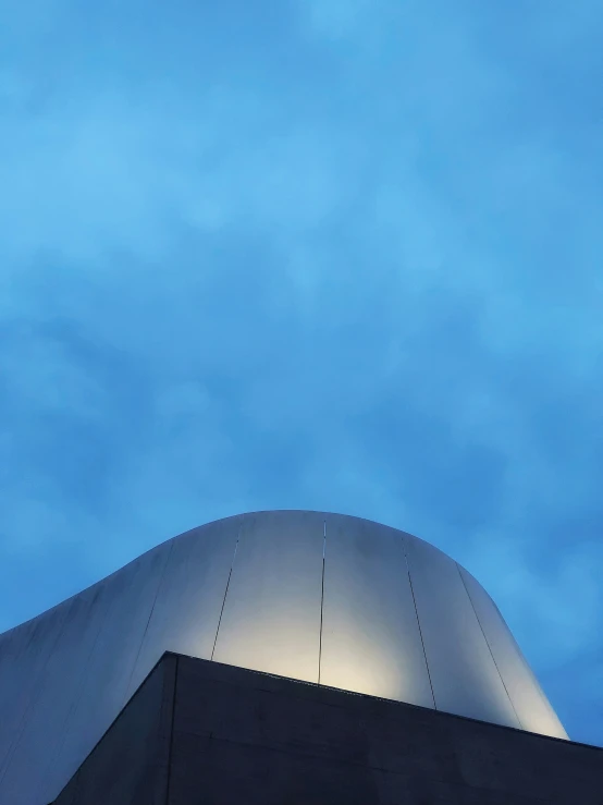 a view from below at the roof of a building