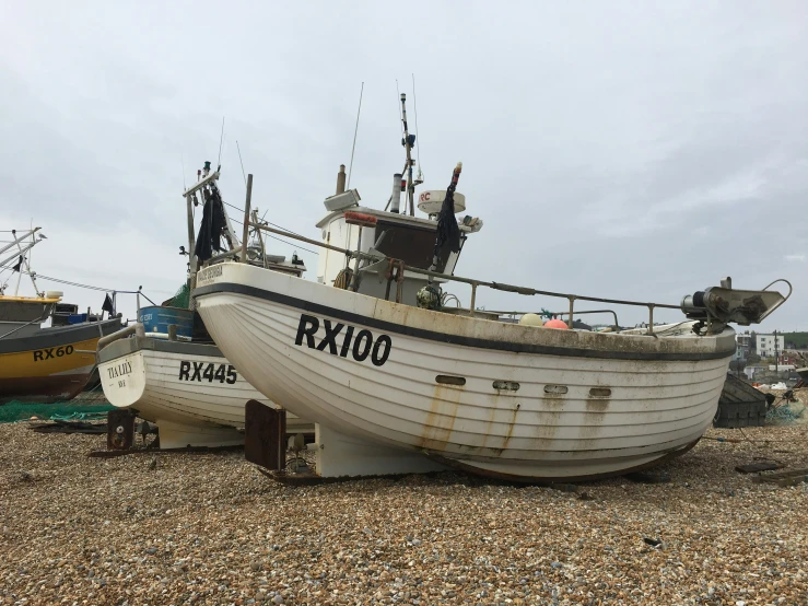 two ships that are sitting on the beach