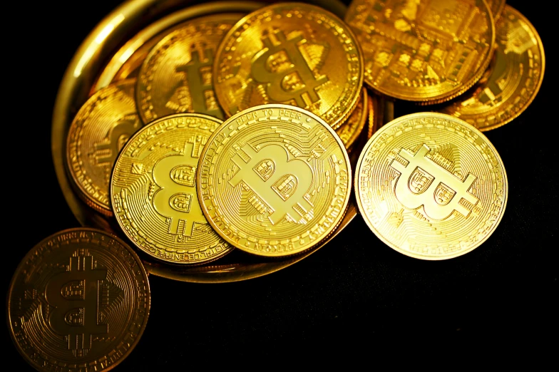 an array of bitcoin gold coins are shown