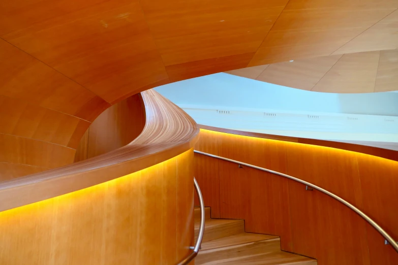 some stairs inside a wooden structure with light