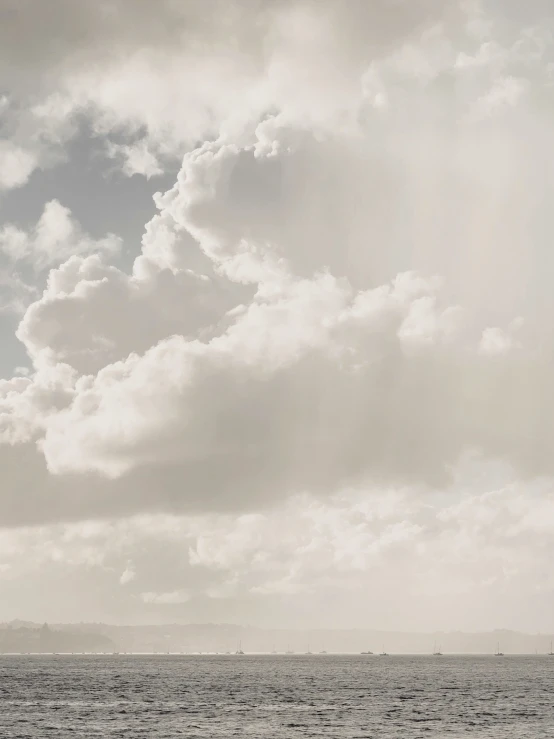 a large body of water under a cloudy sky