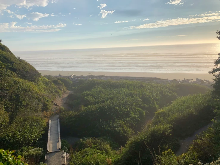 there is a train on the tracks next to a beach