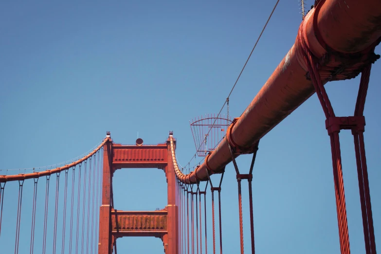 looking up at the golden gate bridge from below