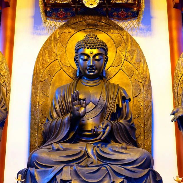 a big buddha statue inside a building