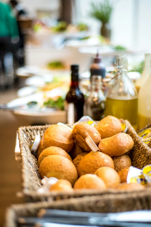 a basket full of bread sitting on a table