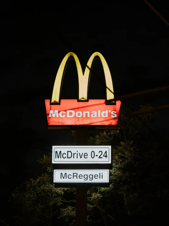 the sign says mcdonald's with a large red bag