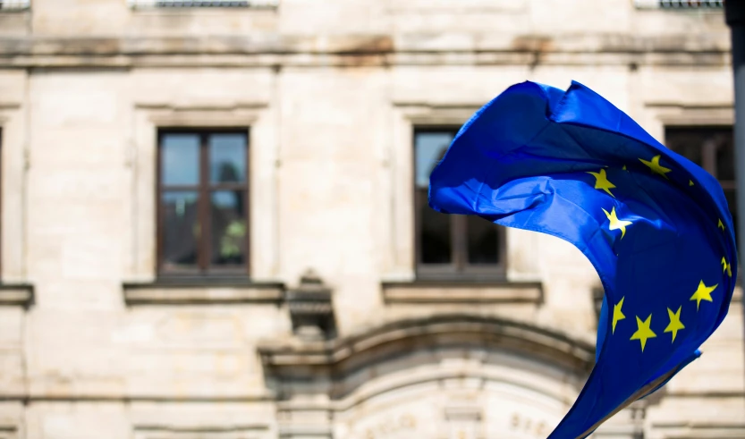 a european flag in front of a building