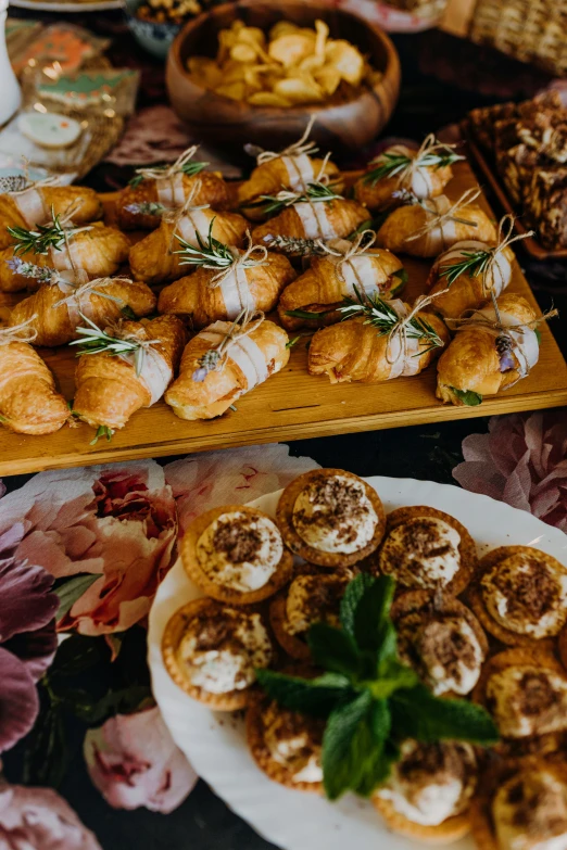 different plates with bread and rolls on a table