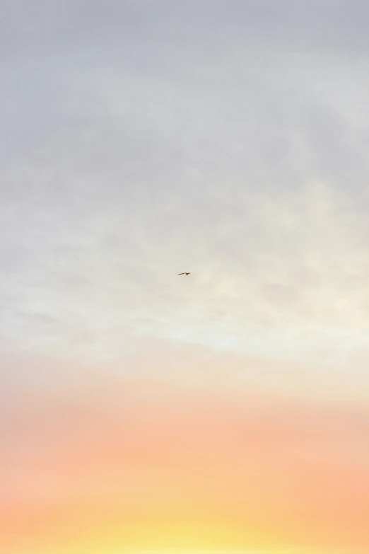 a airplane is in the sky above an ocean