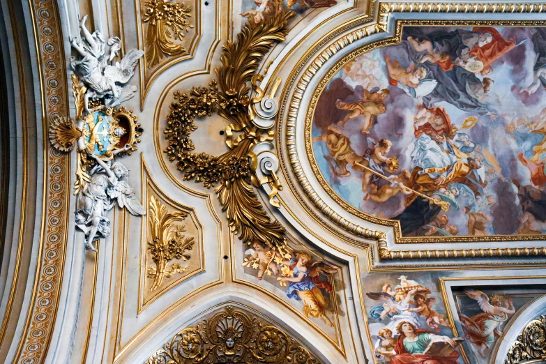 an artistic ceiling with paintings, art work, and other elements