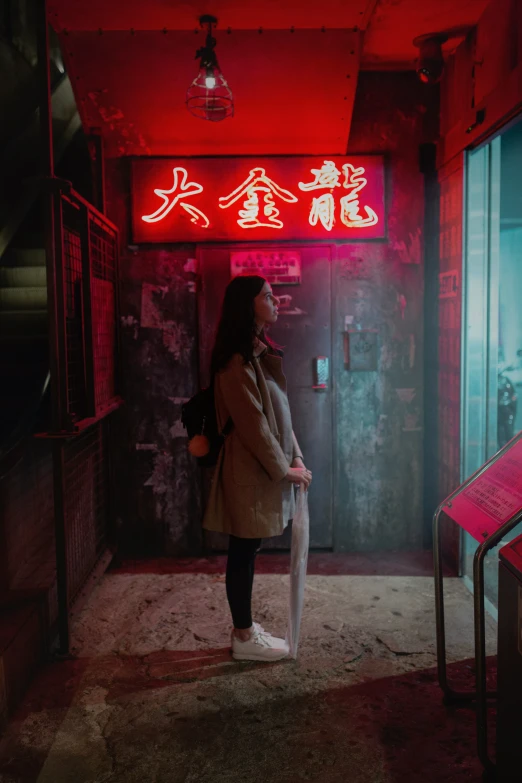 a woman standing on a platform by a building