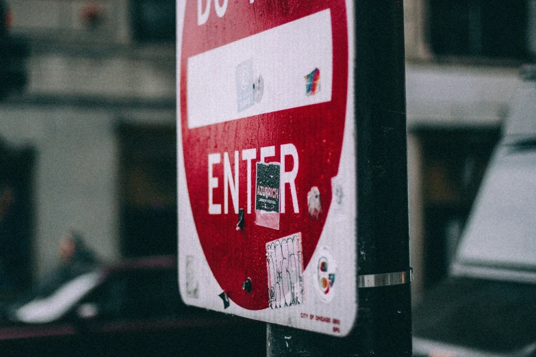 a red and white street sign in a street