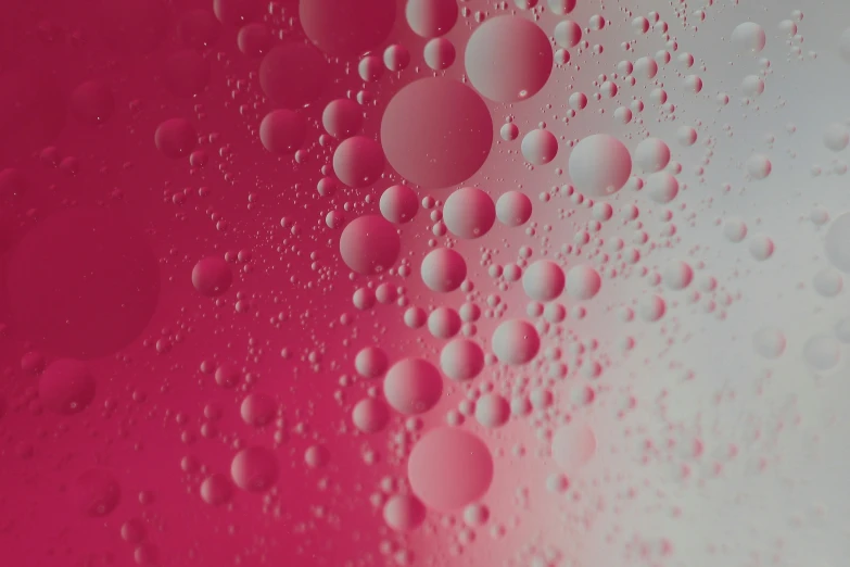 a closeup of pink water on the surface