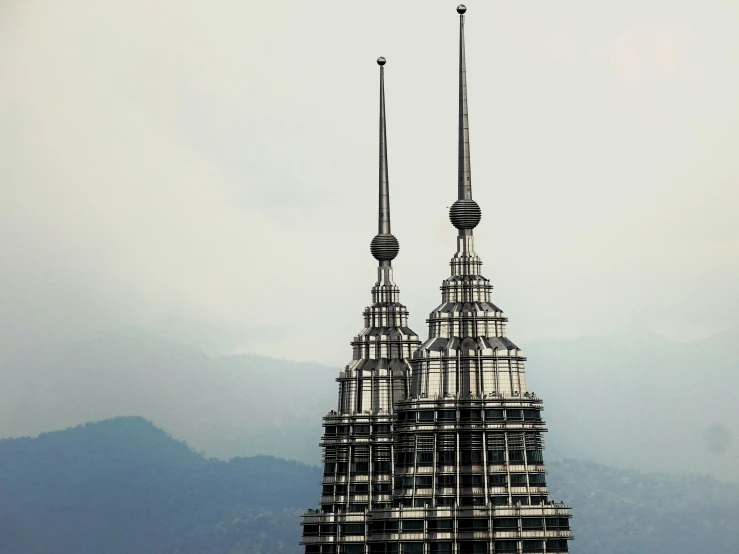 a large building that is sitting next to some hills