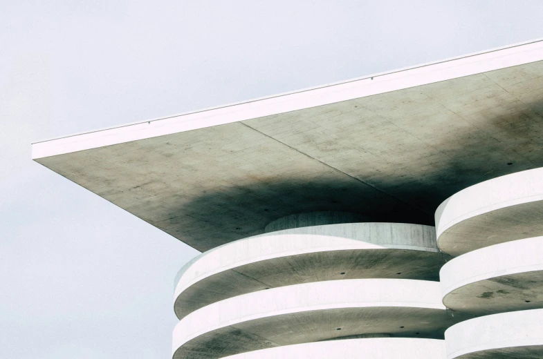 a tall building with circular pillars on it