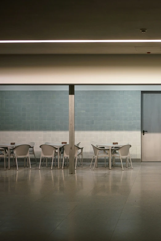 a long table that has some chairs next to it