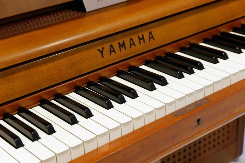 a piano with yamaha written on it is seen in this picture