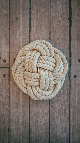 rope wrapped in a knot on a wooden board