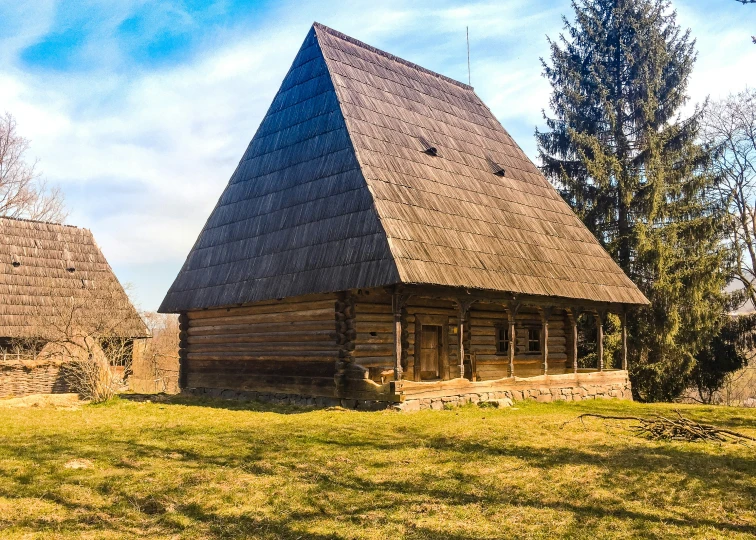 a very big nice looking house made of wood