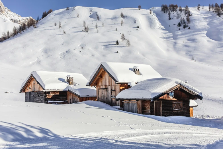 a snowy mountain view with lots of houses