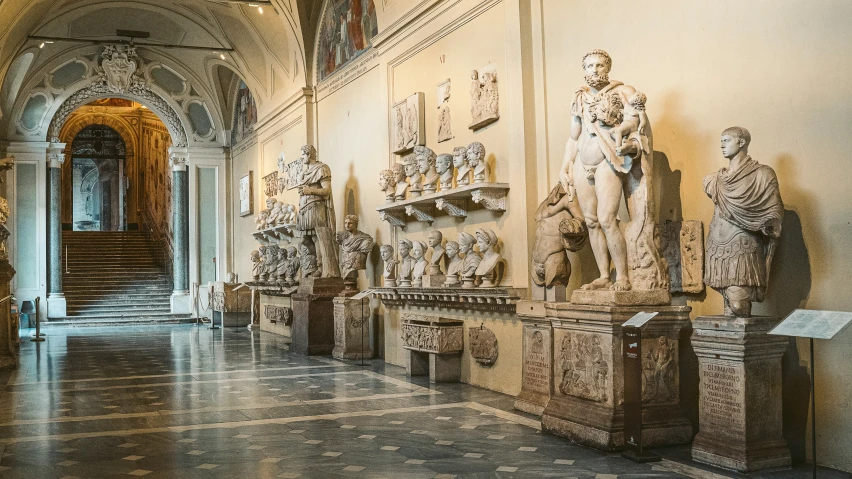 an interior view of museum looking towards some statues