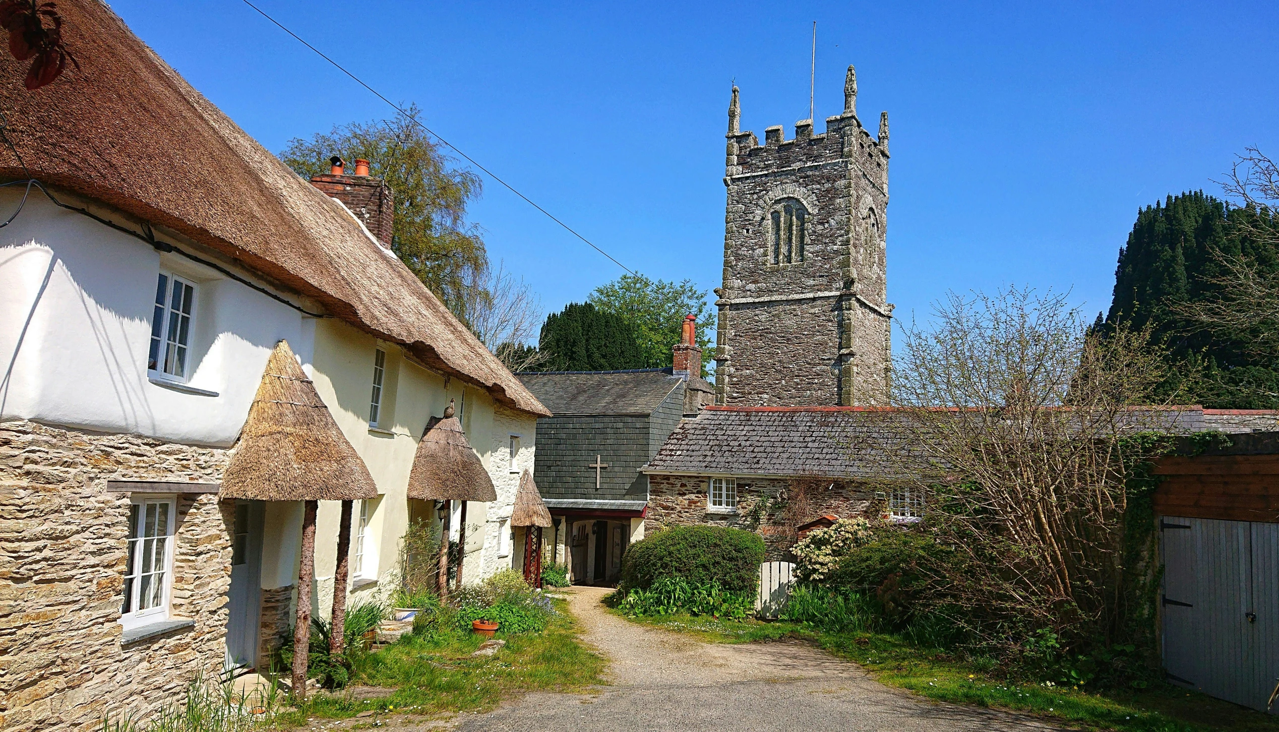 an image of thatch roof houses in europe