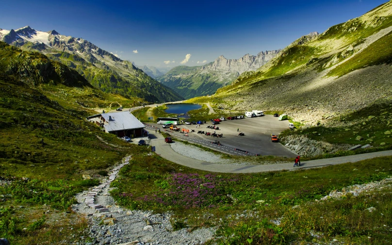 an aerial view of the road with some parked cars in it