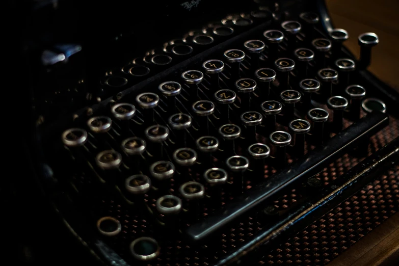 an old fashioned typewriter sitting on a wooden table