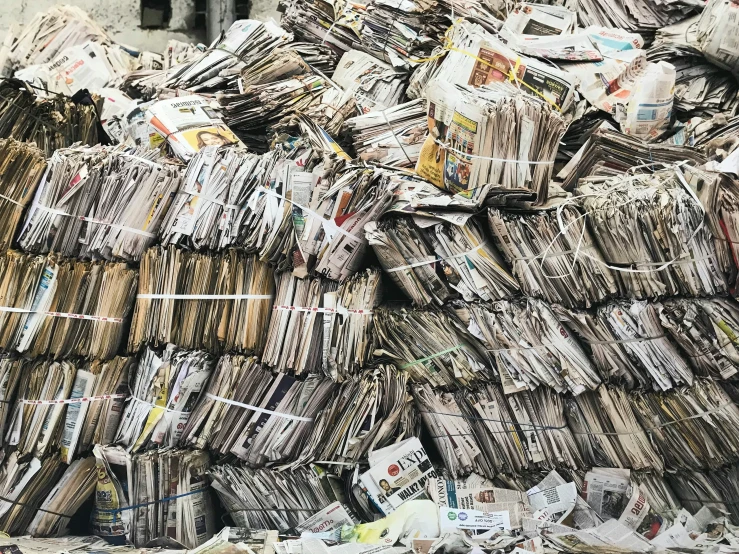 newspapers piled on top of each other in piles