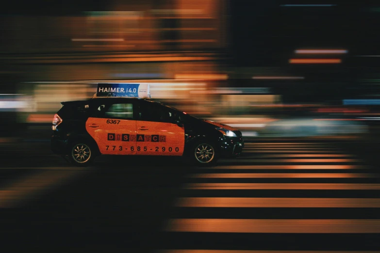 this is an image of an orange and black car