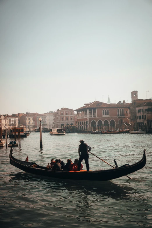 a gondola on the water with people in it