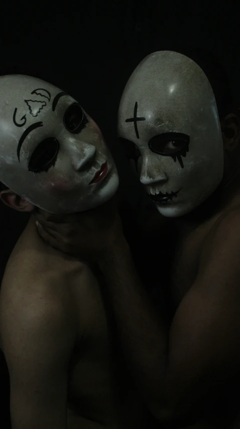 two guys are covered in a white mask