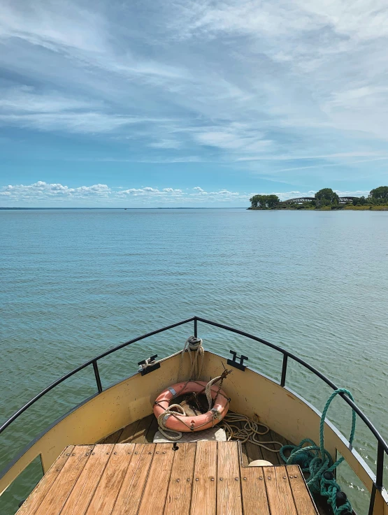 a wooden deck with an inflatable raft on top of it