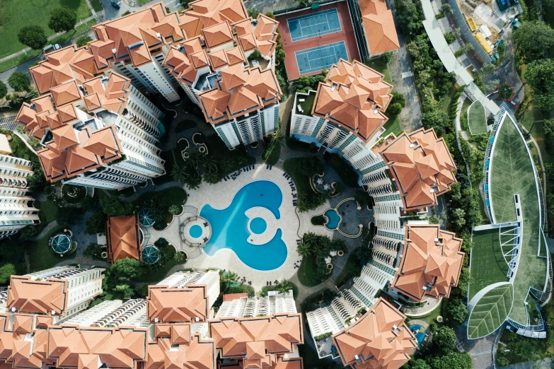 an aerial po of a resort with pool and  springs