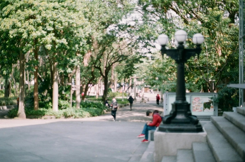 a person sitting at a bench on the steps