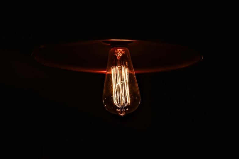 an electric light bulb is shown at night