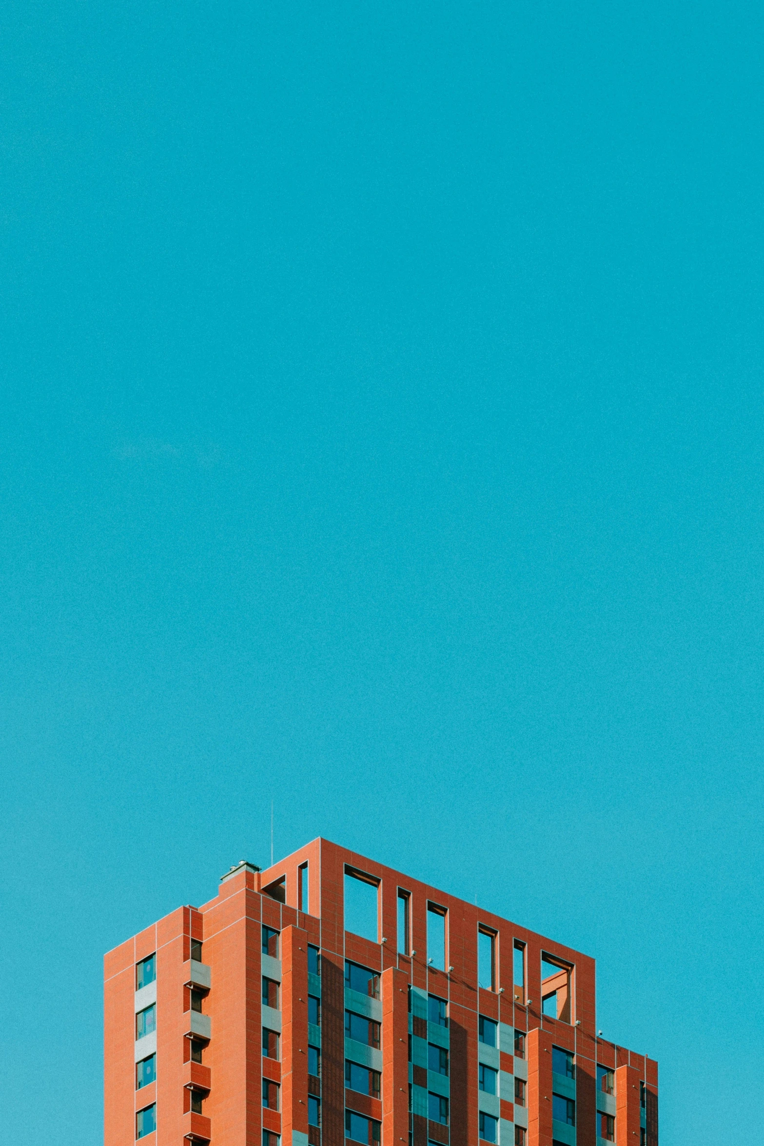 a large tall building sitting next to a clock tower