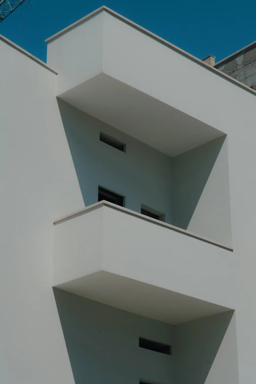 the bottom side of a building with balconies