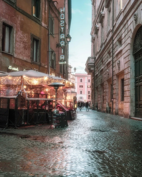 an old city street with stores set up on the side