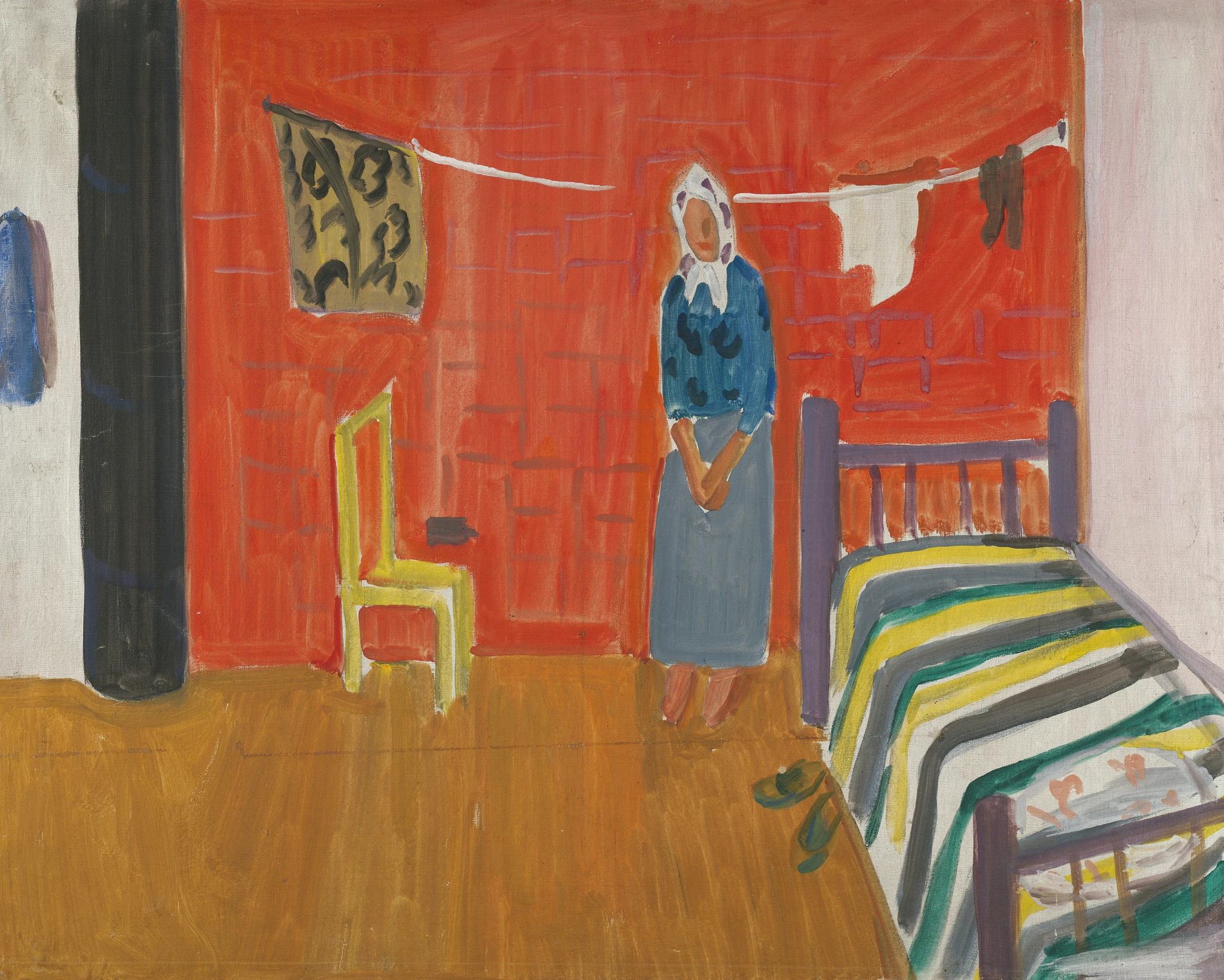 a woman is standing next to her bed in the room