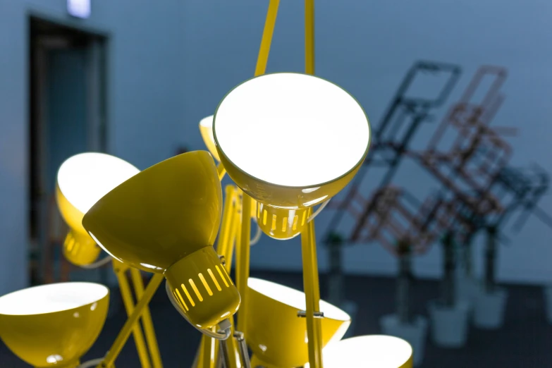 a collection of yellow chairs on a rack