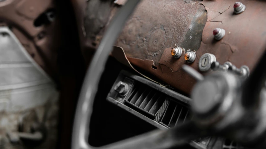 old and rusty cars are shown close together